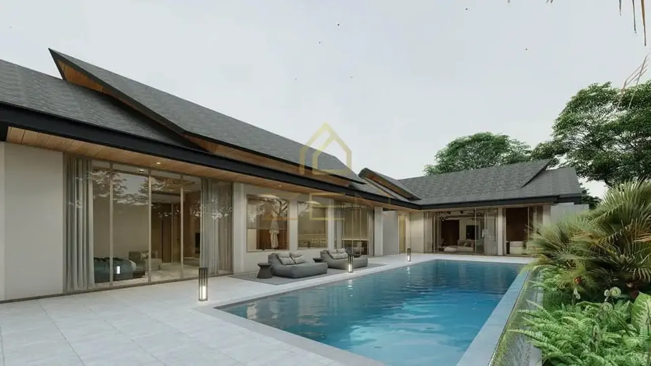 Single-storey villa with a dark pitched roof and full-height glazing along a long pool and stone terrace.